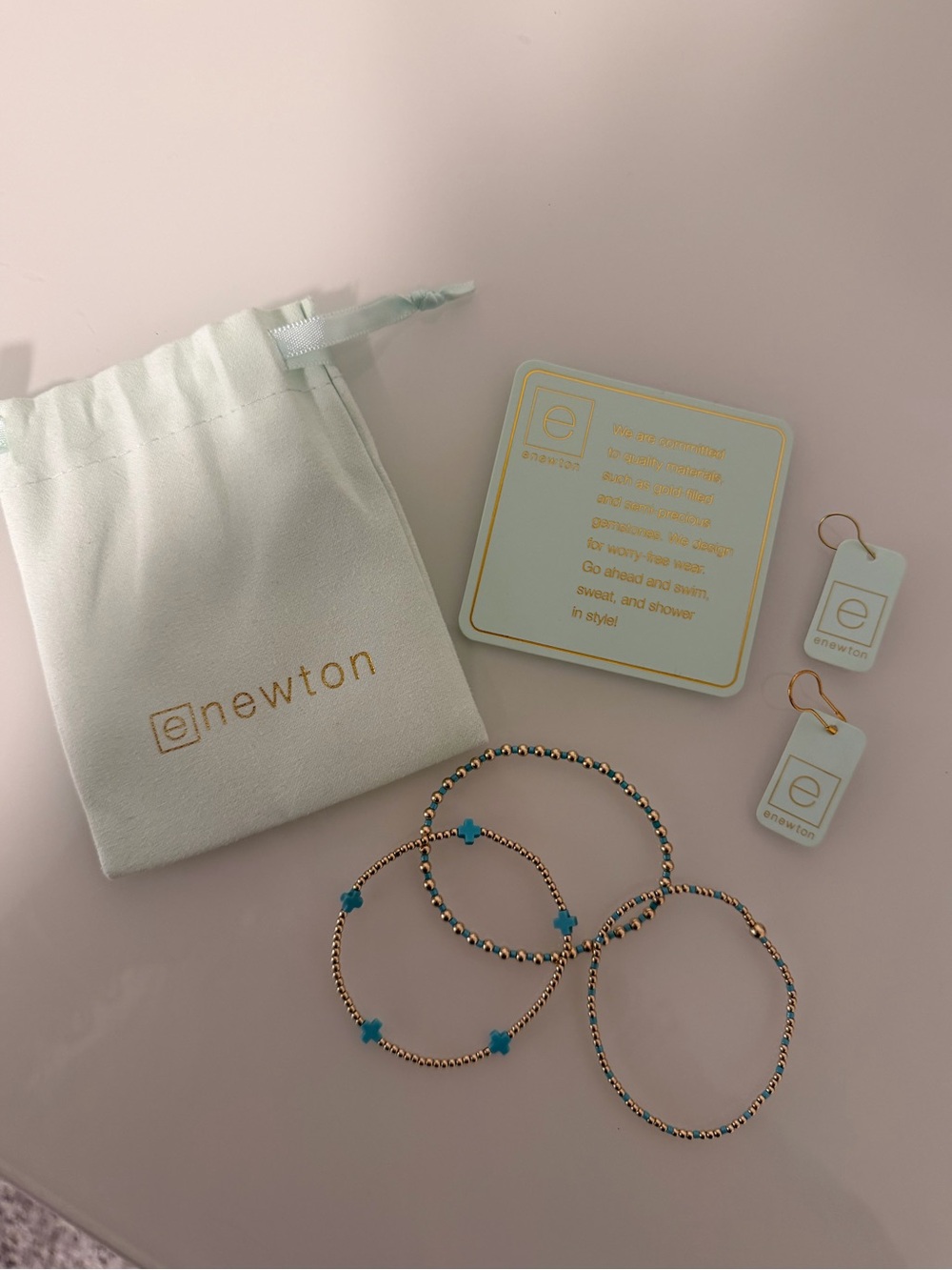 Enewton gold and turquoise bracelets